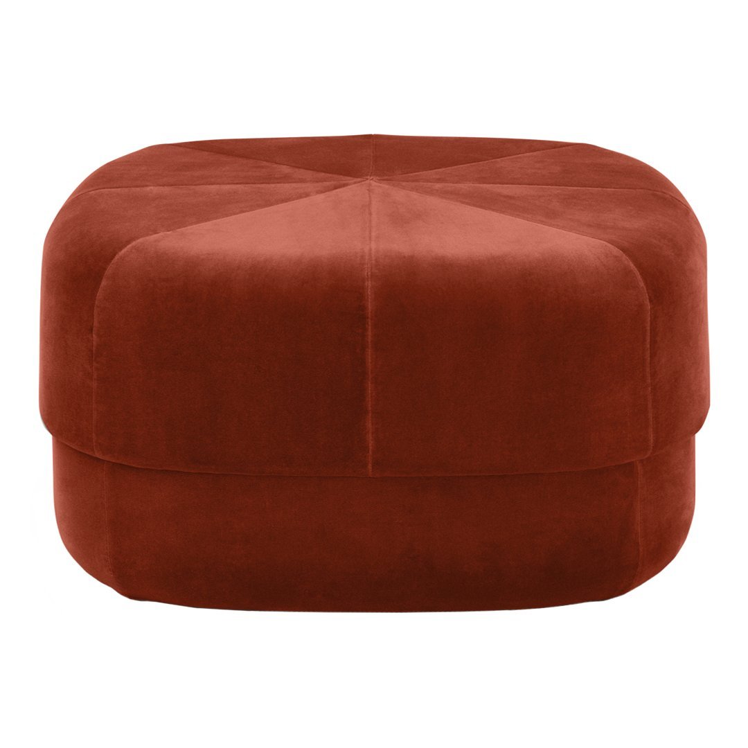 Rust-colored velvet pouf with a geometric pattern and smooth, soft texture for stylish home decor.