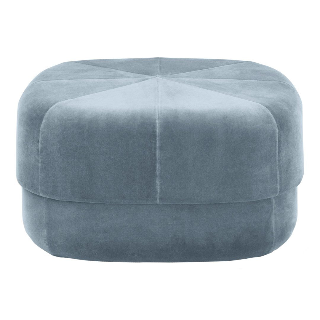Soft blue upholstered ottoman with a smooth finish and subtle geometric pattern. Perfect for stylish home décor.