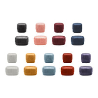 Colorful silicone food storage containers in varied shades: black, pink, red, blue, purple, white, and yellow.