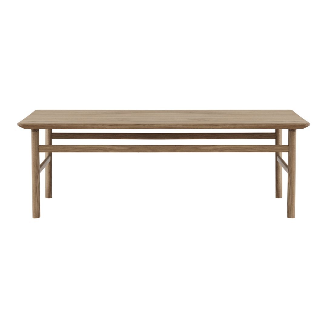 Natural wood dining table in a light oak finish, featuring a simple, modern design with clean lines.