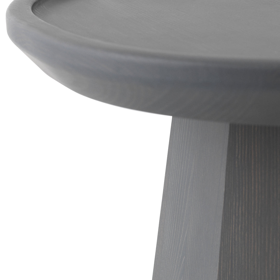 Gray round tabletop with a smooth finish, featuring subtle vertical wood grain patterns.