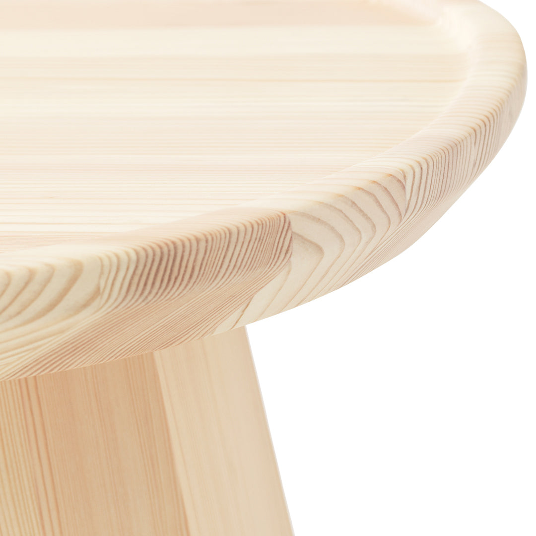 Natural light wood table with smooth, rounded edges and subtle grain patterns. Perfect for a minimalist decor.