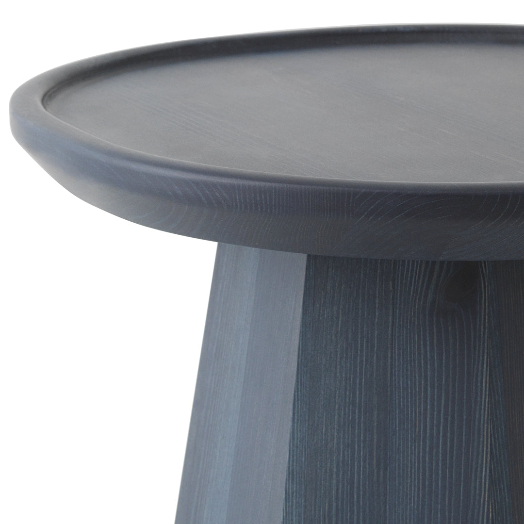 Round tabletop in deep charcoal gray with a smooth finish and textured base in a lighter gray wood grain pattern.