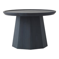 Round black table with a geometric pedestal base and sleek, modern design.