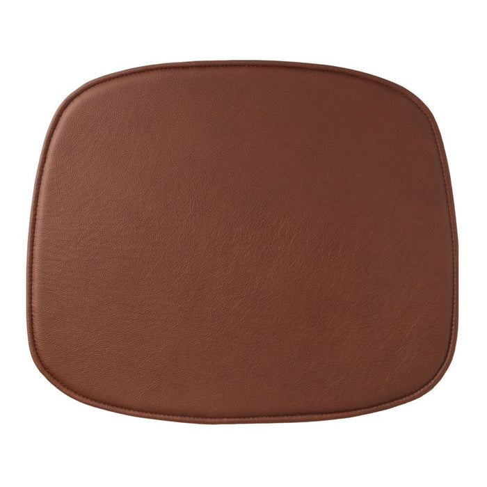 Brown leather cushion with a smooth, rounded square shape, ideal for stylish home decor.