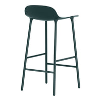 Sleek black bar stool with smooth curves and minimalist design on slender legs for a modern aesthetic.
