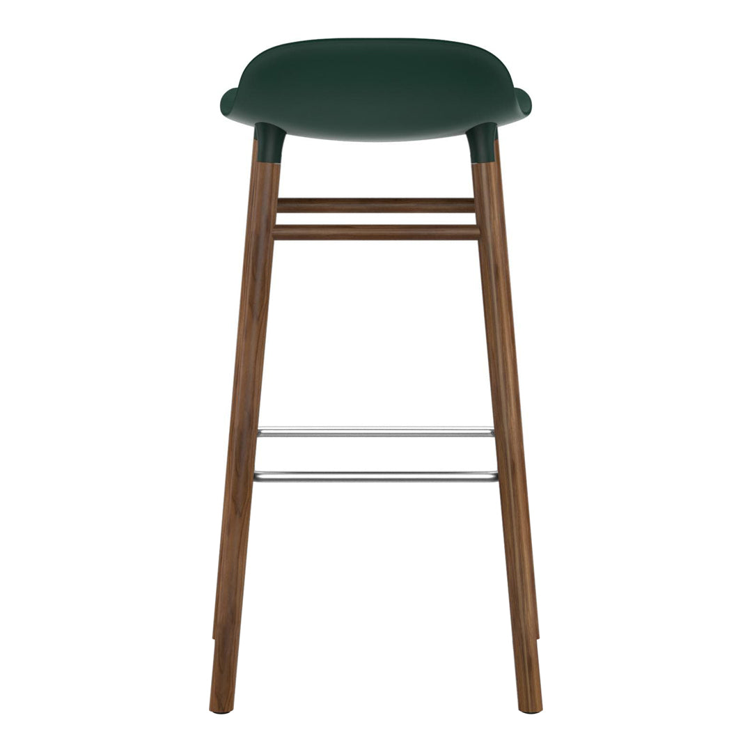 Green upholstered bar stool with wooden legs and chrome footrest, featuring a smooth, minimalist design.
