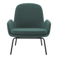 Green upholstered armchair with smooth surface and minimalistic design, featuring a black metal frame. Perfect for modern decor.