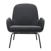 Modern gray lounge chair with smooth fabric and minimalist design, featuring curved backrest and sleek metal legs.