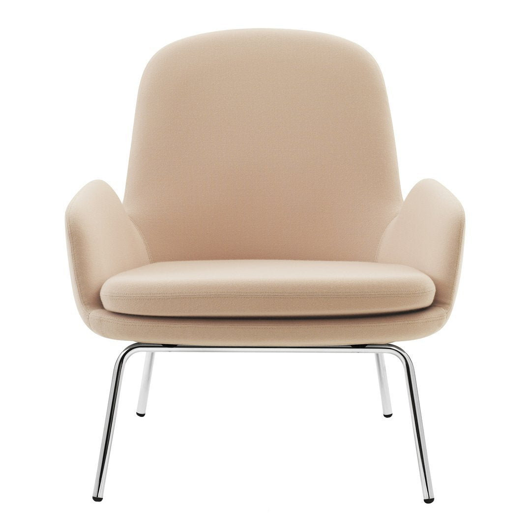 Soft beige armchair with a smooth, minimalist design and sleek chrome legs. Perfect for modern interiors.
