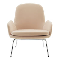 Soft beige armchair with a smooth, minimalist design and sleek chrome legs. Perfect for modern interiors.