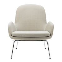 Light beige chair with smooth, rounded lines and a subtle textured pattern, featuring chrome legs for a modern touch.