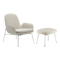 Light gray upholstered chair and ottoman with minimalist design and chrome legs, perfect for modern interiors.