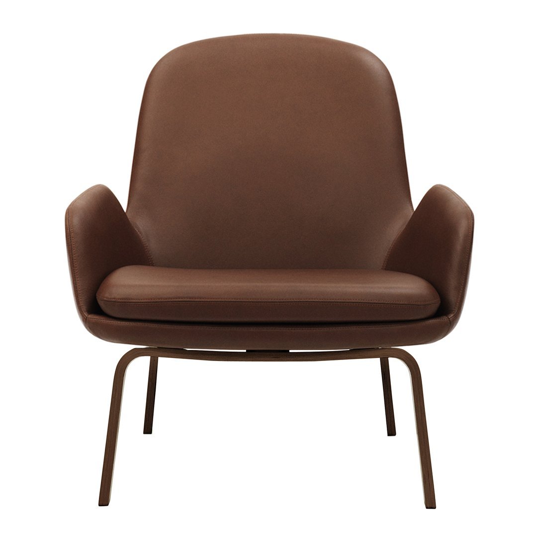 Brown leather accent chair with smooth, minimalist design and slender metal legs. Perfect for modern decor.