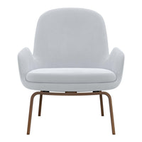 Modern light gray upholstered chair with smooth, minimalistic design and wooden legs. Perfect for contemporary decor.