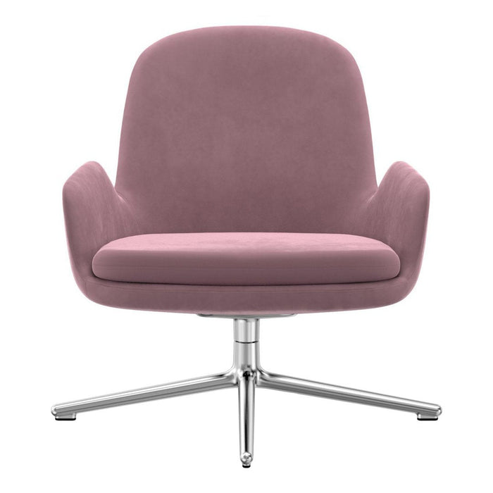 Pink velvet armchair with a sleek chrome base, featuring a minimalist design and smooth, soft texture.