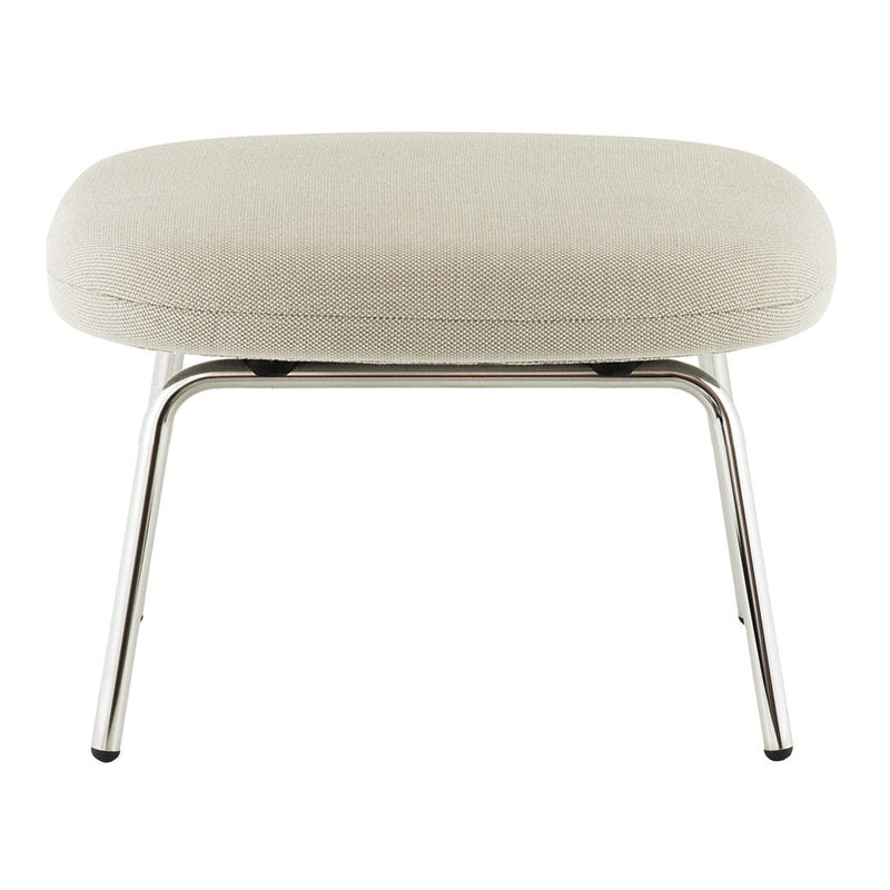 Beige upholstered ottoman with a smooth texture and sleek chrome legs, featuring a minimalist design.