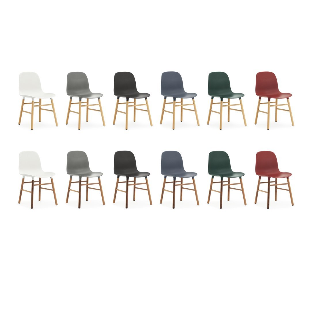 Colorful set of modern chairs in white, gray, navy, green, and burgundy with natural wood legs.