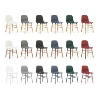 Set of colorful chairs in white, gray, navy, green, and burgundy with wooden legs, showcasing diverse patterns and styles.