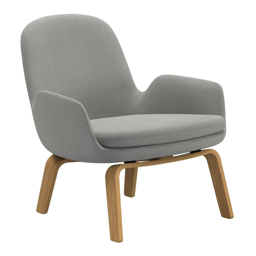 Gray fabric armchair with smooth curves and natural wood legs, perfect for modern decor.
