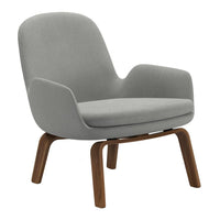 Gray upholstered lounge chair with a smooth, modern design and wooden legs for a stylish touch.