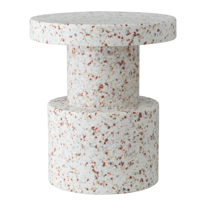 White terrazzo table with subtle speckles in warm tones of orange and brown, featuring a modern geometric design.