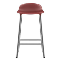 Burgundy stool with a smooth finish and gray metal legs, perfect for modern interiors.