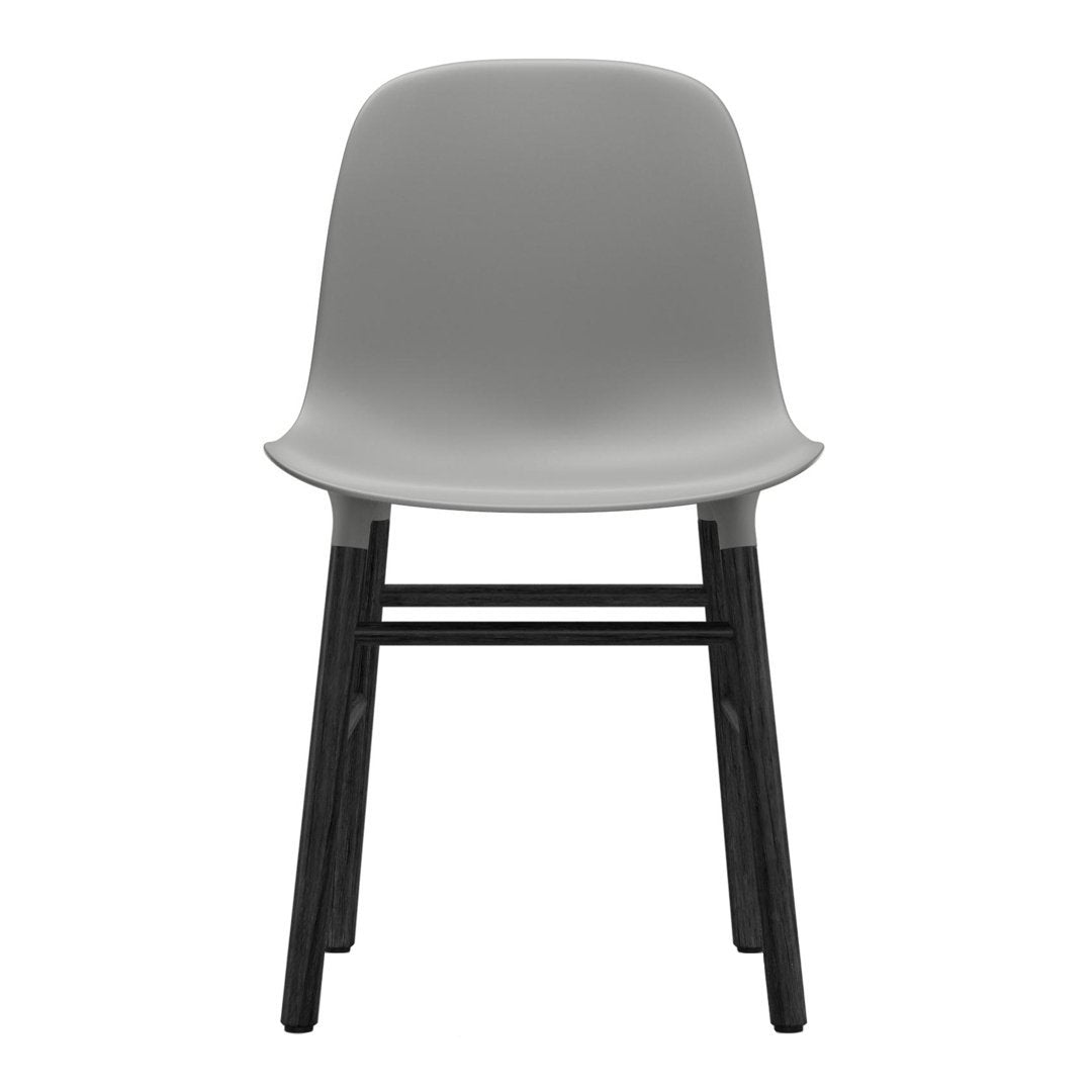 Gray plastic chair with a smooth finish and black wooden legs, featuring a minimalist design and a modern aesthetic.