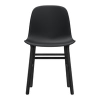 Minimalist black chair with a sleek seat and natural wood legs, emphasizing modern design and clean lines.
