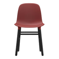 Stylish maroon plastic chair with a sleek black wooden frame, perfect for modern decor.