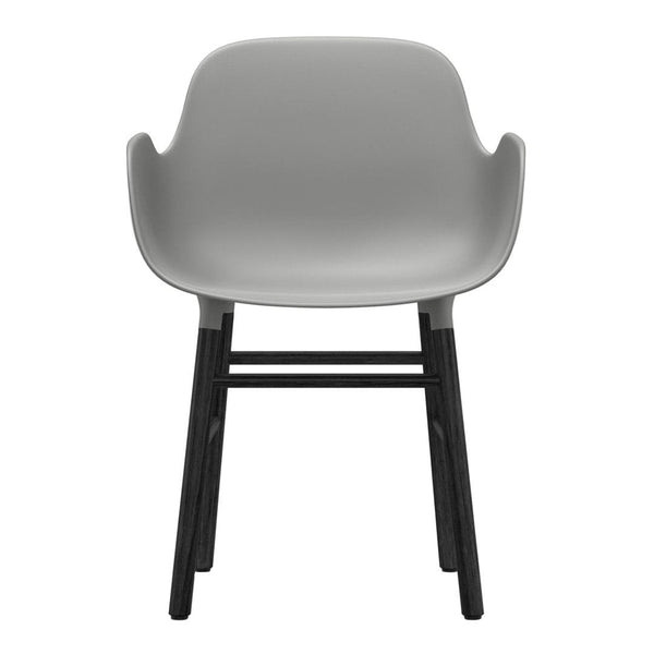 Modern grey plastic chair with smooth finish and sleek black wooden legs. Minimalist design suitable for various interiors.