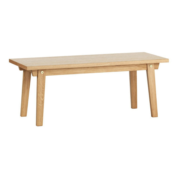 Natural wood coffee table with a light oak finish and minimalist design, featuring smooth surfaces and a simple pattern.
