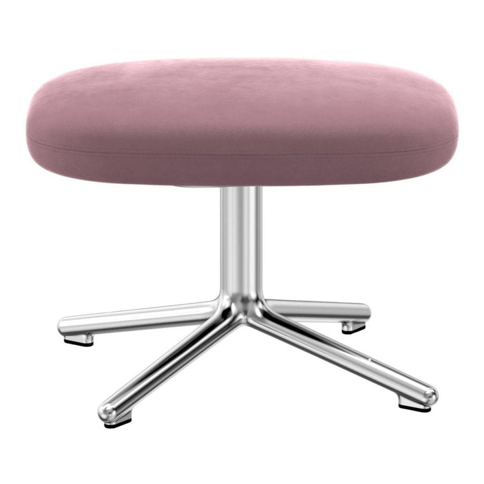 Round pink velvet stool with a sleek chrome base, perfect for modern decor.