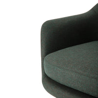 Green textured fabric armchair with subtle flecked pattern and contoured design. Ideal for modern decor.