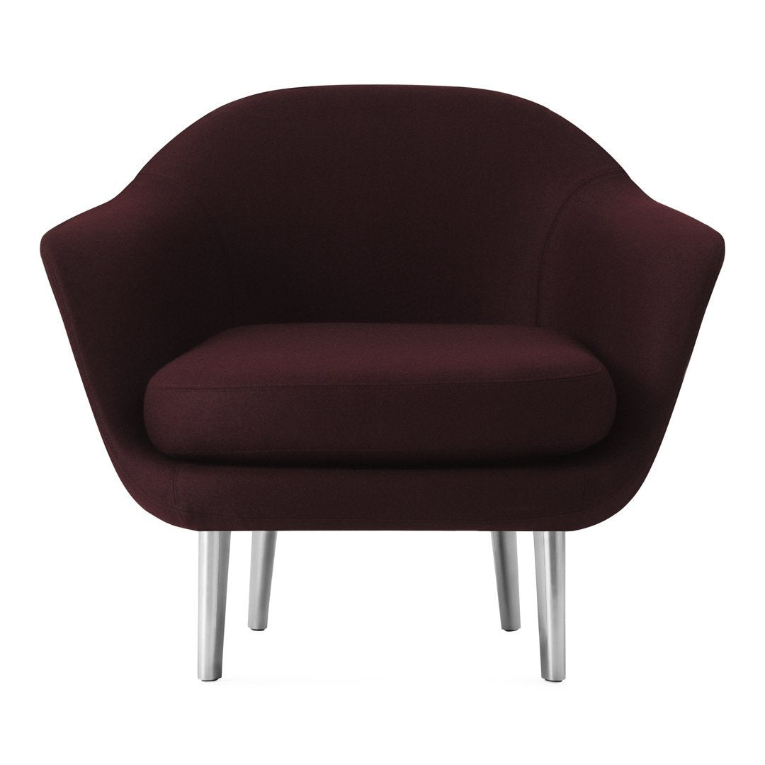 Burgundy plush armchair with a smooth, rounded design and sleek silver legs. Perfect for modern decor.