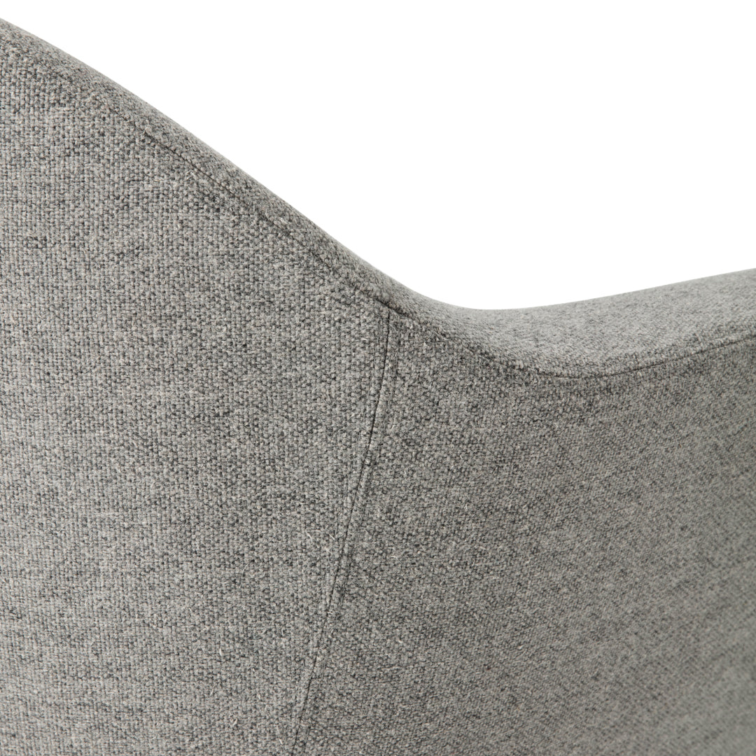 Gray fabric accent chair with a smooth, contemporary pattern and rounded edges. Perfect for modern decor.