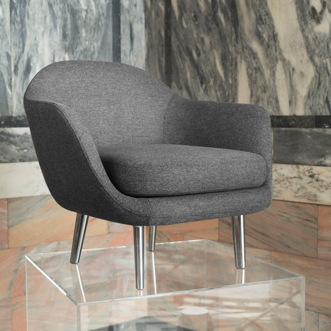 Stylish gray upholstered chair with smooth curves and chrome legs, perfect for modern interiors.