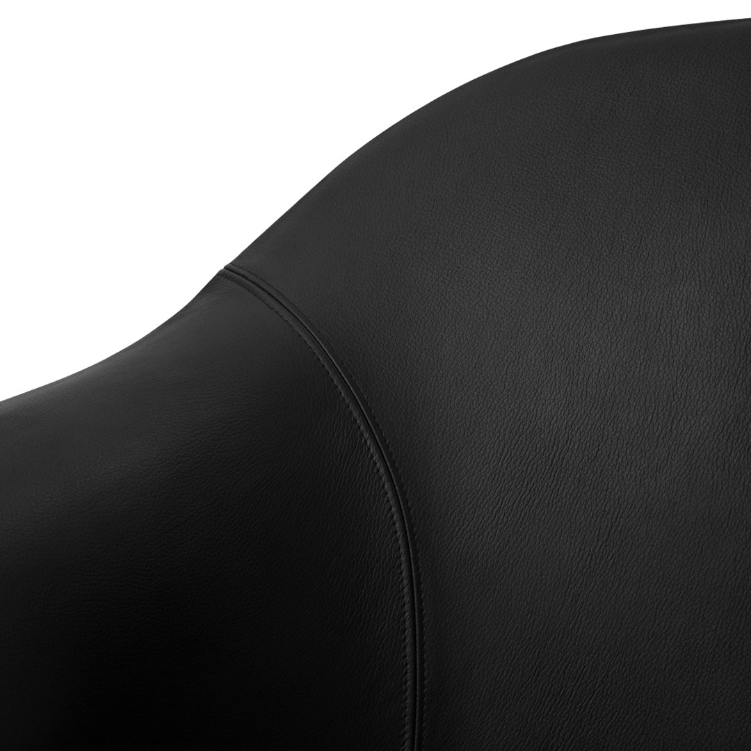 Black leather surface with a smooth finish and subtle stitching details, showcasing a sleek, modern design.