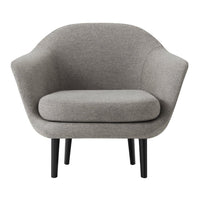 Cozy light gray armchair with smooth, rounded contours and sleek black legs for modern elegance. Stylish and inviting.
