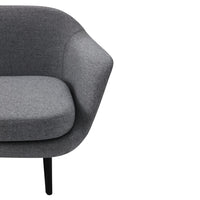 Stylish gray upholstered chair with a smooth texture and minimalist design, perfect for modern decor.