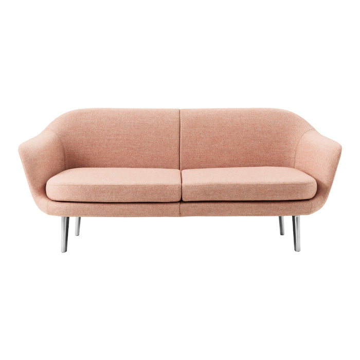 Soft pink upholstered sofa with a smooth texture and minimalistic design, featuring sleek silver legs.