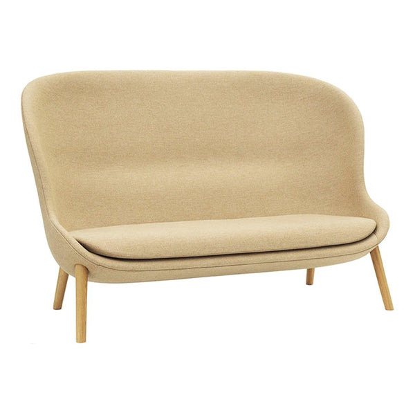 Beige two-seater sofa with a smooth, minimalist design and light wooden legs, featuring a soft, textured fabric upholstery.