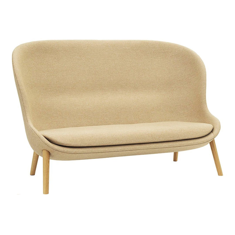 Beige two-seater sofa with a smooth, minimalist design and light wooden legs, featuring a soft, textured fabric upholstery.