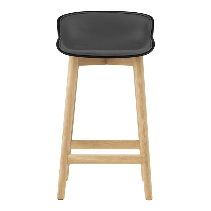 Black padded seat with natural wood legs, minimalist design ideal for modern decor.