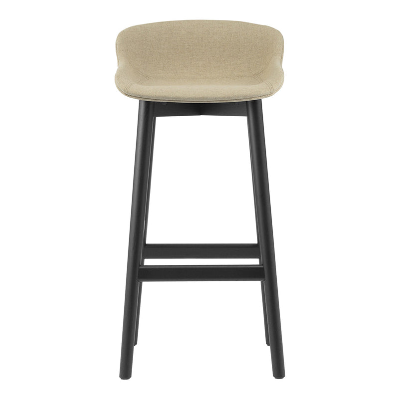 Beige upholstered bar stool with a sleek black wooden frame and minimalistic design. Ideal for modern decor.