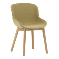 Green upholstered chair with smooth, rounded shape and light wooden legs. Modern, minimalist design perfect for any space.