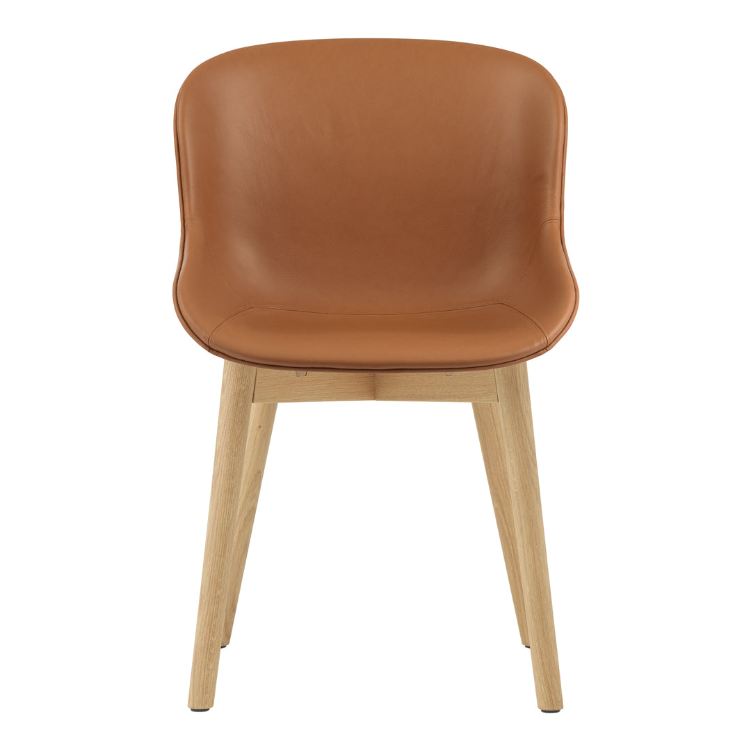 Tan leather chair with smooth, curved design and light wooden legs. Modern and stylish for any decor.