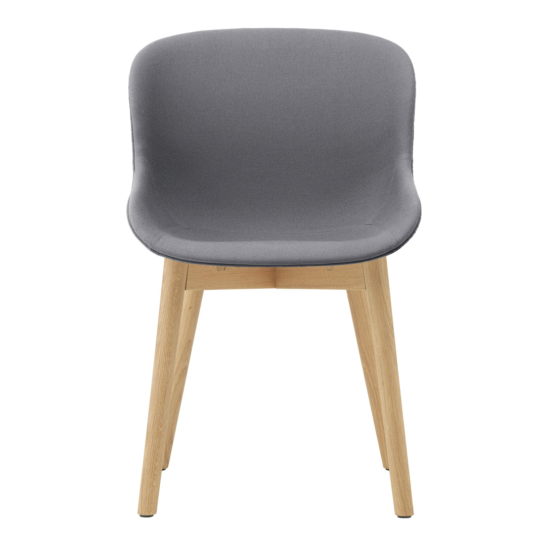 Gray upholstered chair with smooth curves and wooden legs, perfect for modern decor.