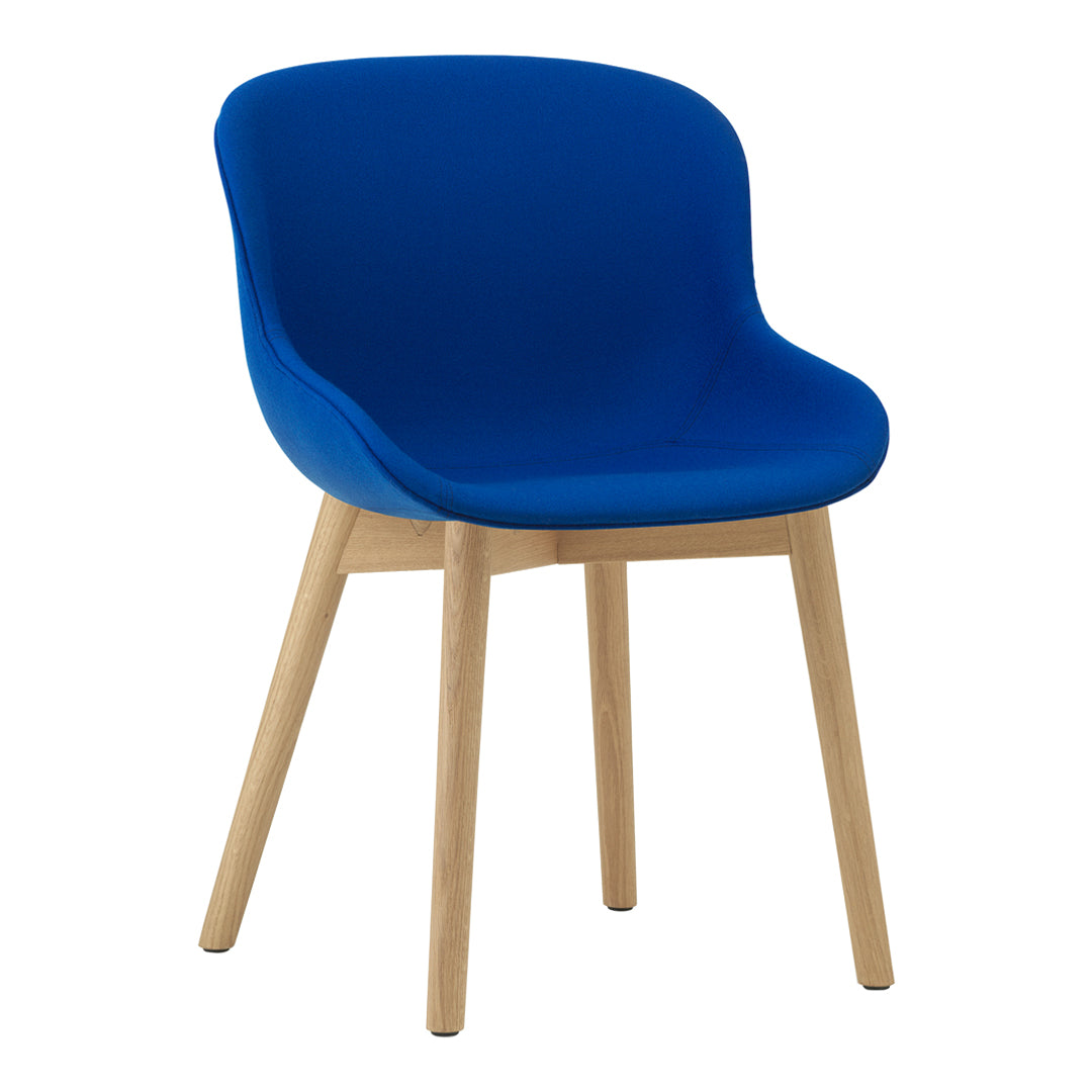 Blue upholstered chair with smooth, curvy lines and natural wood legs, perfect for modern decor.