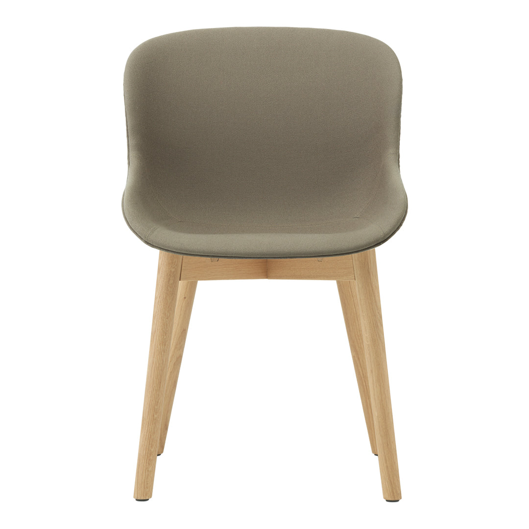 "Modern chair in muted olive green with natural wood legs, featuring a smooth, curved design."